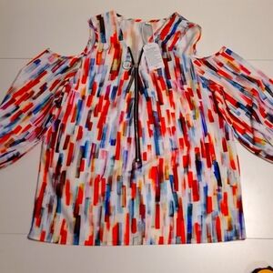 Colorful cold shoulder woman size large zip up lightweight satin feel. NWT